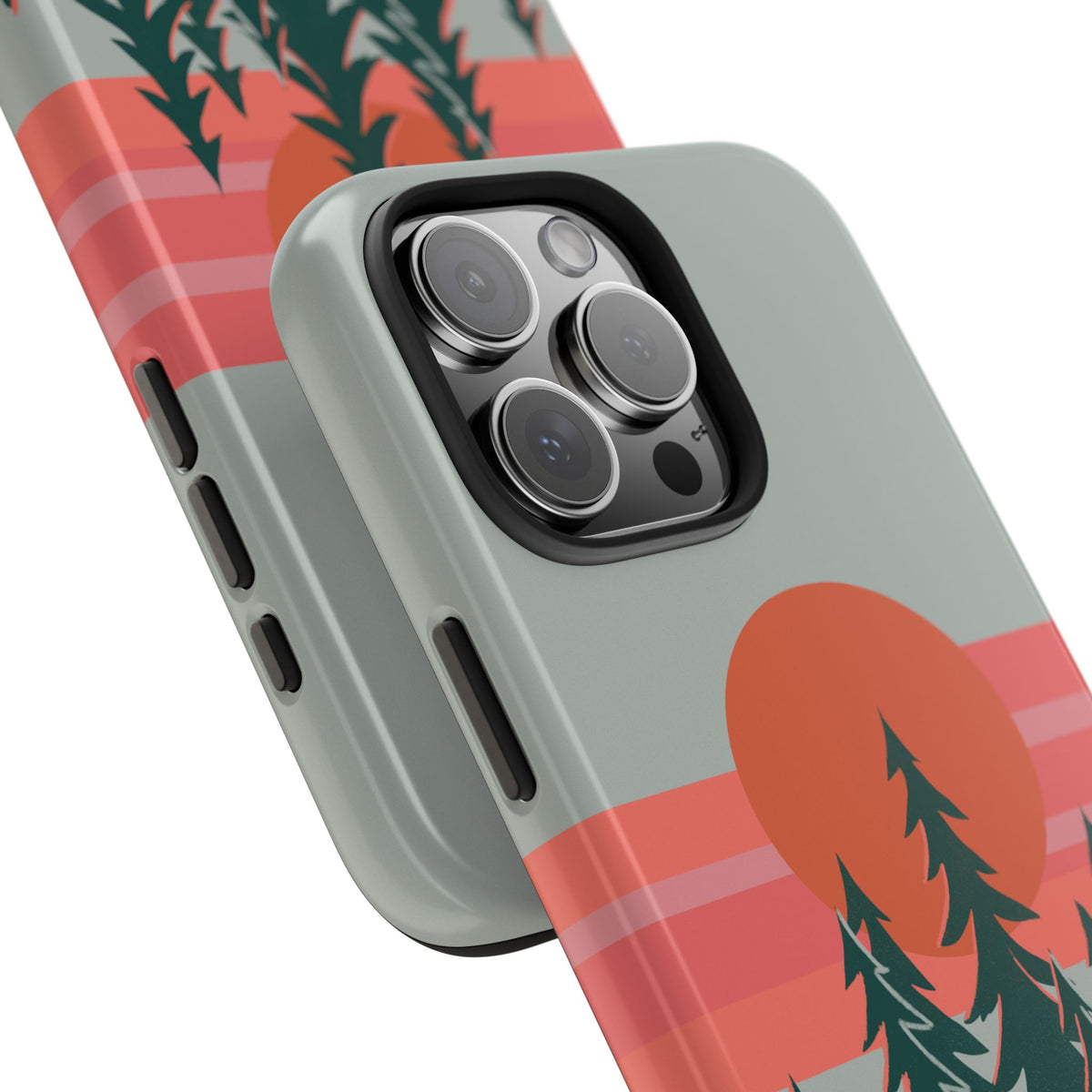 Close-up angled view of the Sunset Pines Phone Case showing the camera cutout with a sunset and pine tree design.