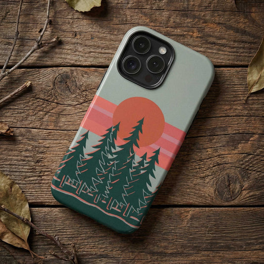Phone case with forest design on a wooden surface