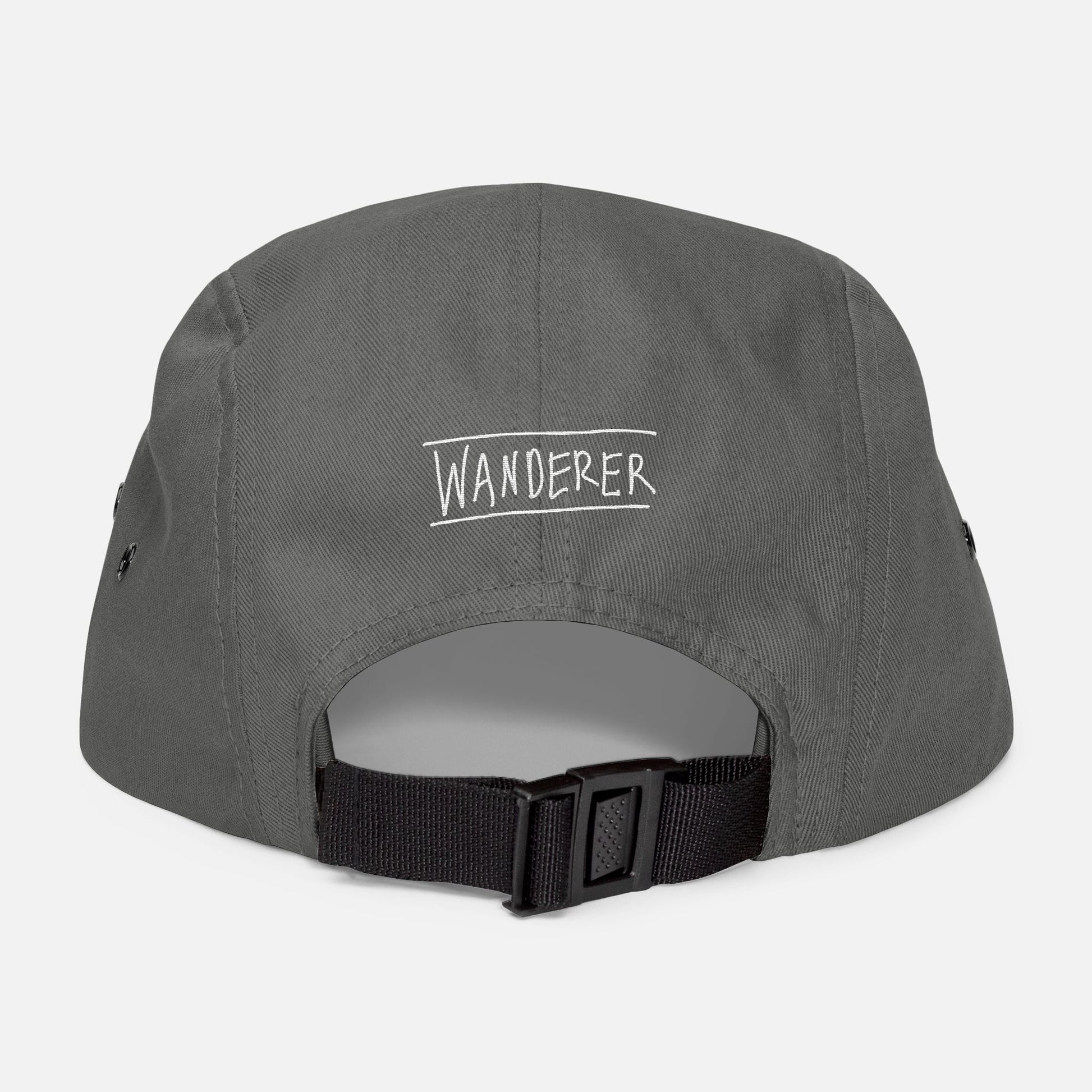 Back view of grey low-profile cap with adjustable strap and “wanderer” embroidered in casual handwritten script.