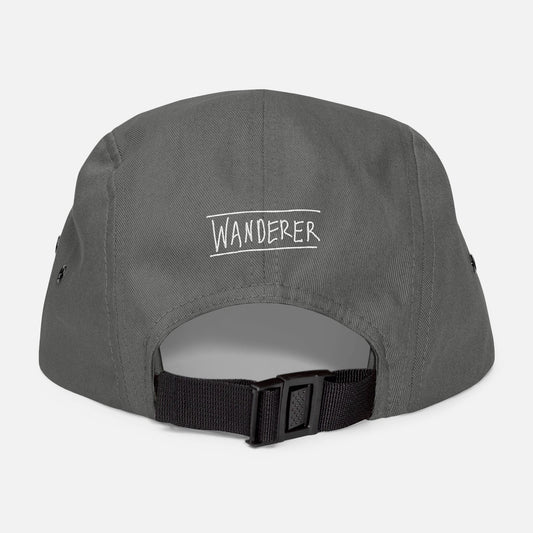 Back view of grey low-profile cap with adjustable strap and “wanderer” embroidered in casual handwritten script.