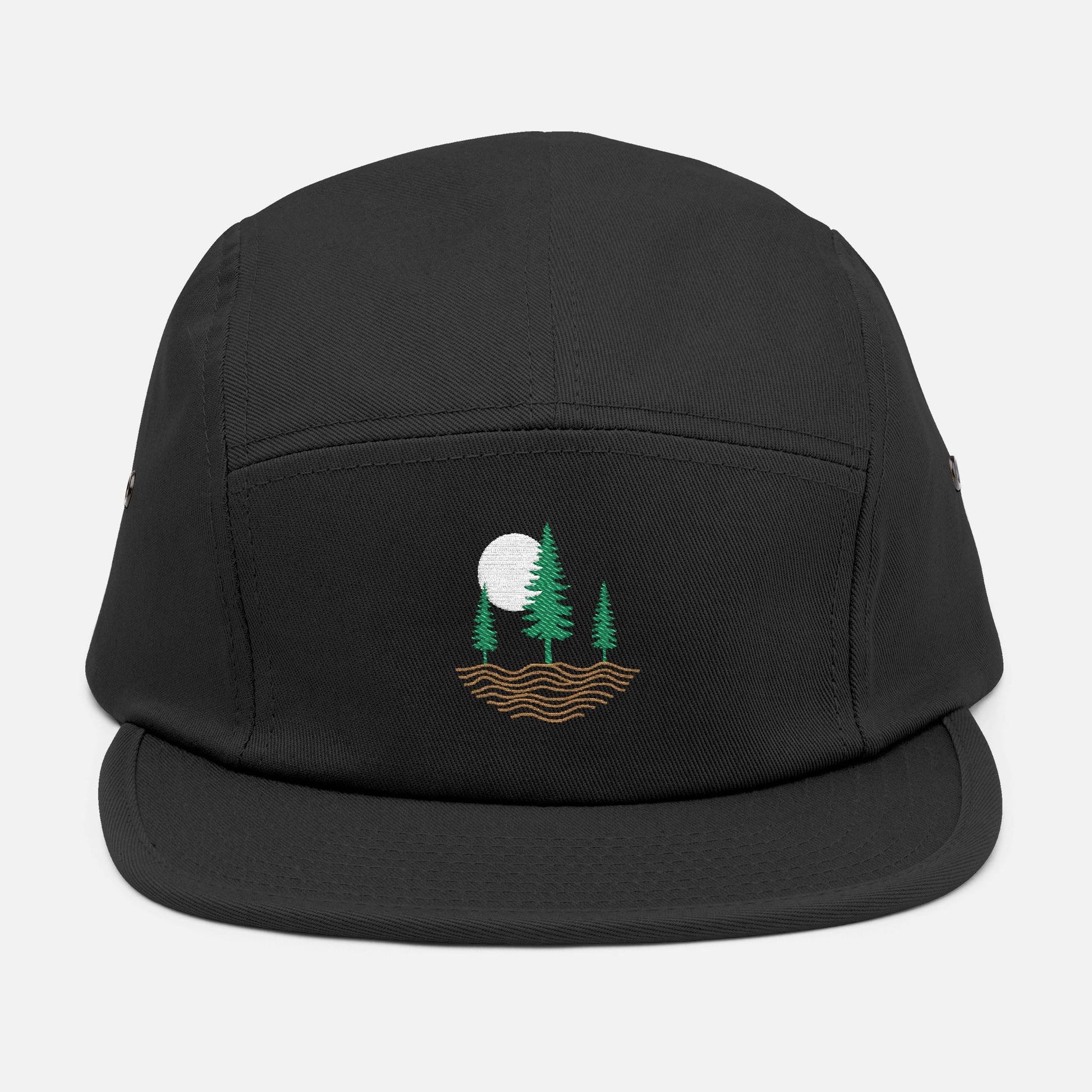 Front view of black low-profile cap with embroidered design of three pine trees, a rising sun, and ripple lines symbolizing the earth.