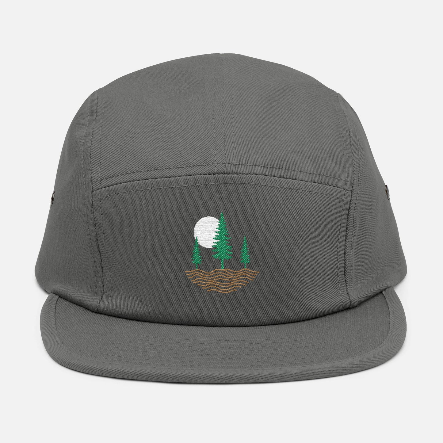 Front view of grey low-profile cap with embroidered design of three pine trees, a rising sun, and ripple lines symbolizing the earth.
