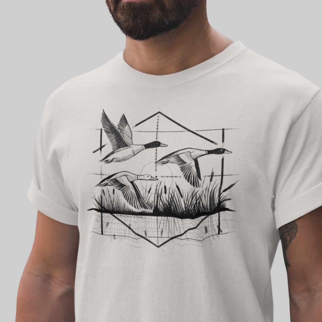 Model wearing Waterfowl Hunter Ducks Tee, featuring a geometric illustration of three flying ducks, perfect for hunters and waterfowl enthusiasts.