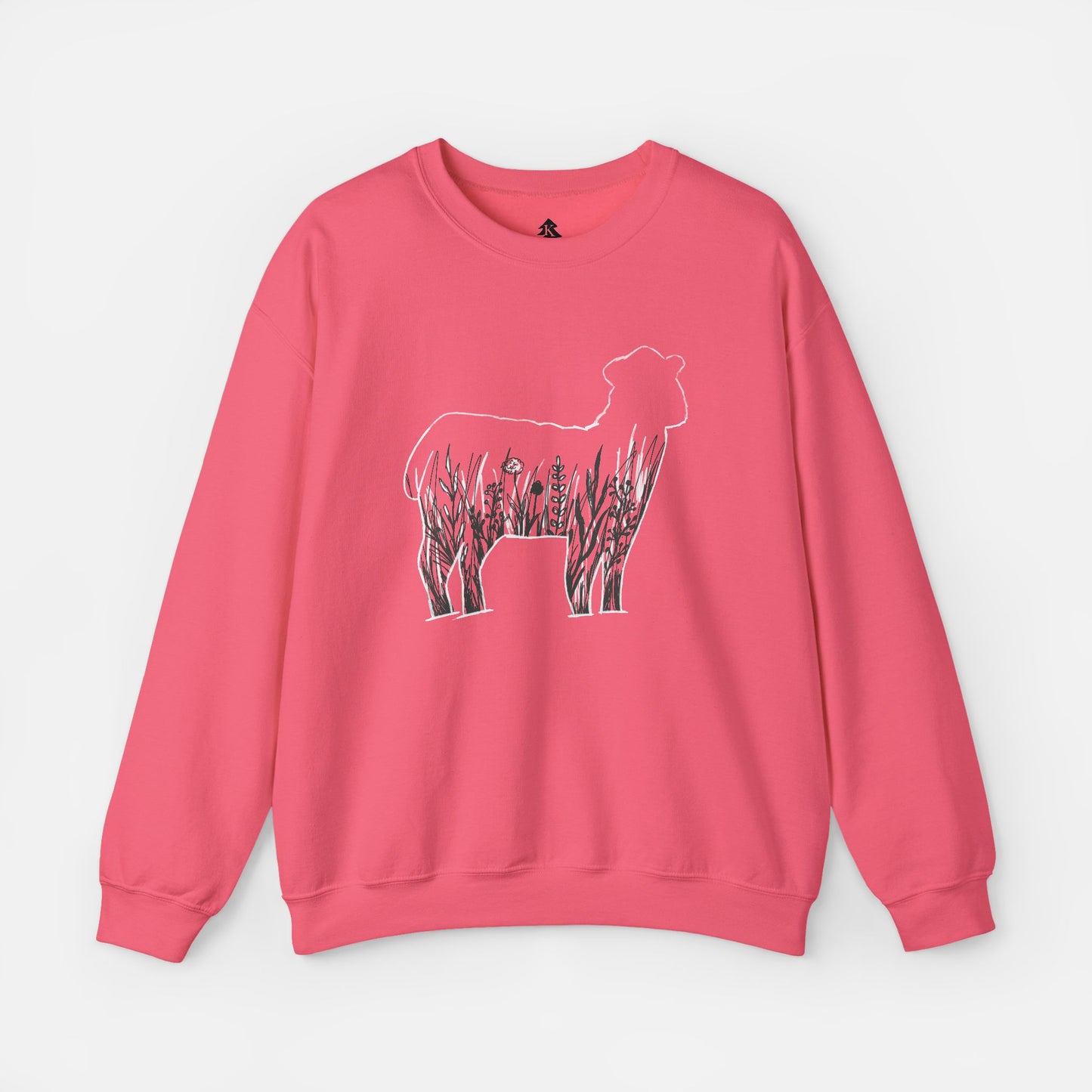 Flat lay of Wildflower Sheep pink sweatshirt on white background showing rustic floral sheep silhouette design centered on front.