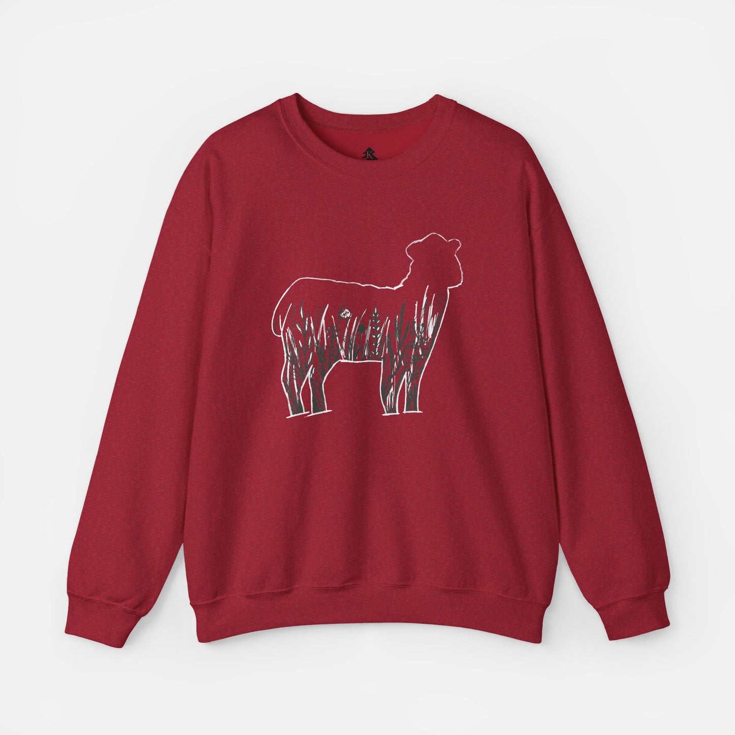 Flat lay of Wildflower Sheep  red sweatshirt on white background showing rustic floral sheep silhouette design centered on front.
