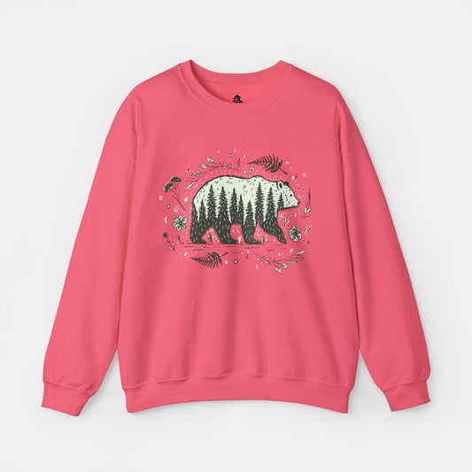 Wandering Bear Women's Sweatshirt in Pink displayed flat on a white background, highlighting its cozy crewneck design and wilderness-themed illustration.