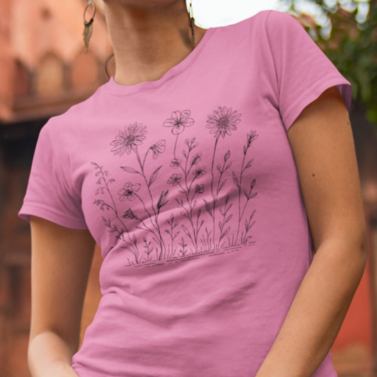 Wildflower Breeze T-Shirt featuring a hand-drawn wildflower illustration, worn by a model for a relaxed and stylish outdoor-inspired look.