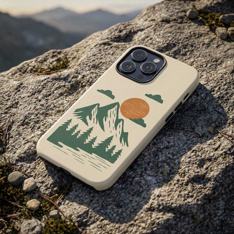 Phone case with an abstract mountain illustration, displayed on a rock against, designed for iPhone and Samsung models.