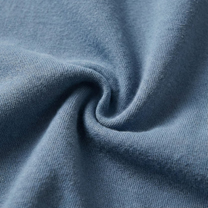 Close-up of 100% ring-spun cotton fabric in Blue Jean, highlighting the lightweight 6.4 oz field-weight texture of Kempain Family Outfitters' artist-series apparel.