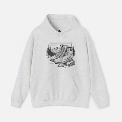 Trek & Trail Hoodie in Ash color displayed on a white background, showcasing the detailed hiking boot and trail illustration.