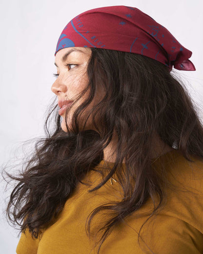 Beet Color Organic Cotton Bandana from United By Blue displayed on a female model.