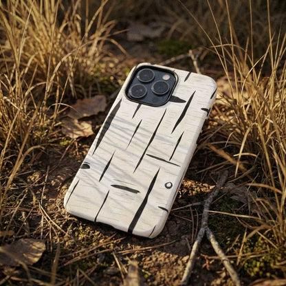 Phone case with a unique birch bark illustrated design on a grassy background