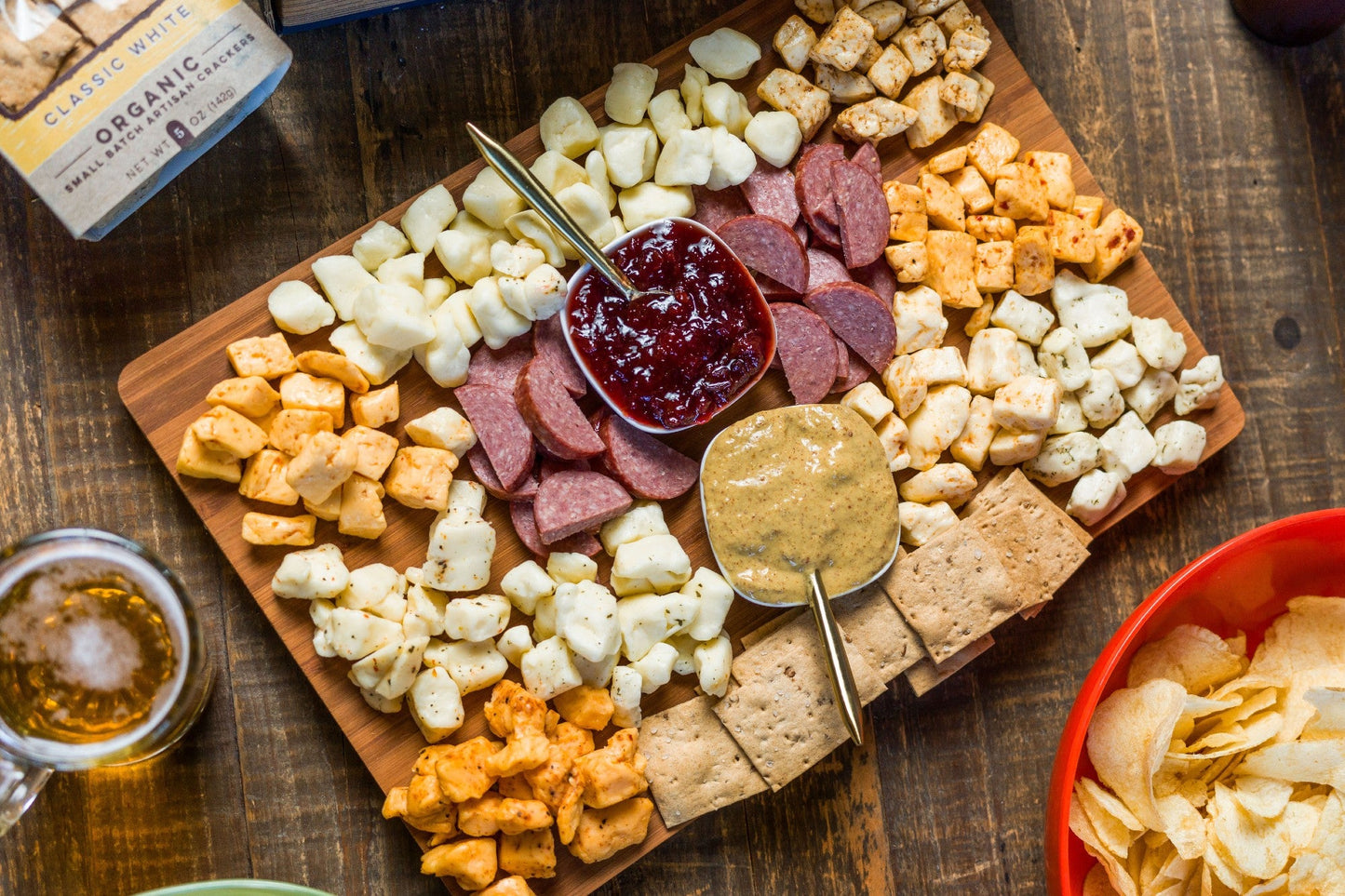 Wisconsin Cheese Curd and Summer Sausage Gift Box with Gourmet Jam, Mustard, and Organic Crackers curated by Kempain Family Outfitters.