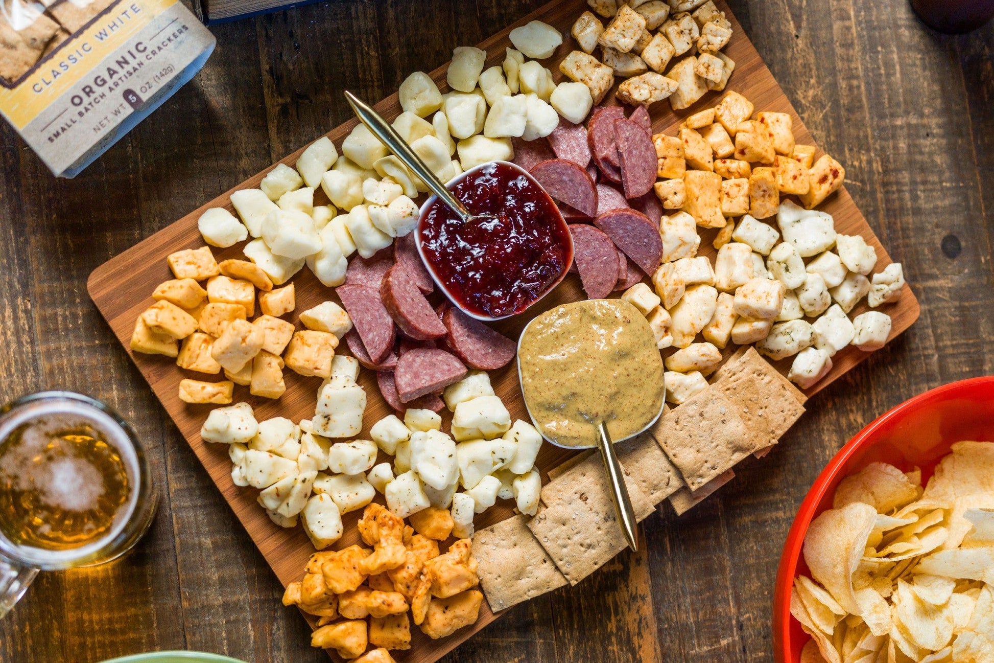 Wisconsin Cheese Curd and Summer Sausage Gift Box with Gourmet Jam, Mustard, and Organic Crackers curated by Kempain Family Outfitters.