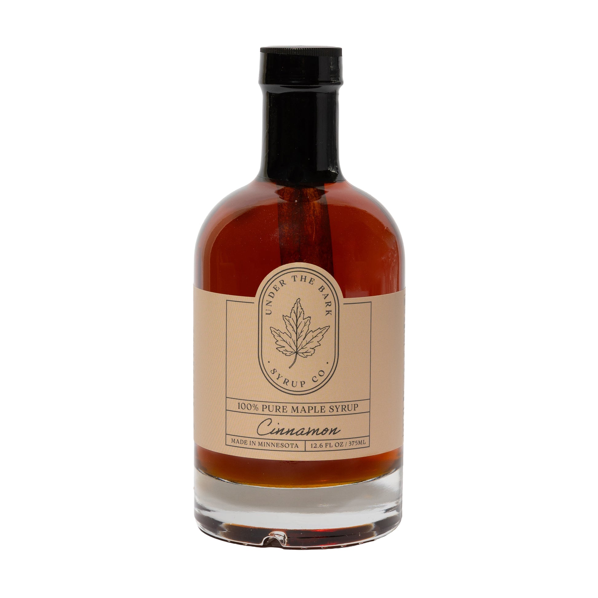 12.6 FL OZ Bottle of cinnamon-flavored 100% pure maple syrup by Under The Bark Syrup Co. on a white background.