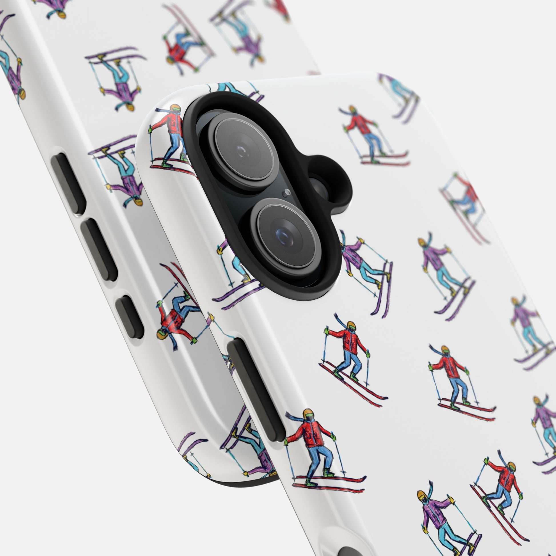 Close-up of the skier pattern on the phone case, showcasing detailed illustrations of skiers in motion.
