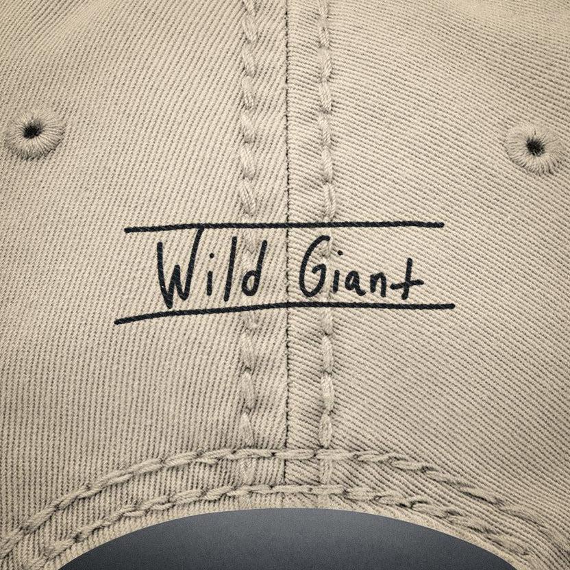 Close up of the back of hat featuring the "Wild Giant" hand written font embroidery by Jordan Kempain.