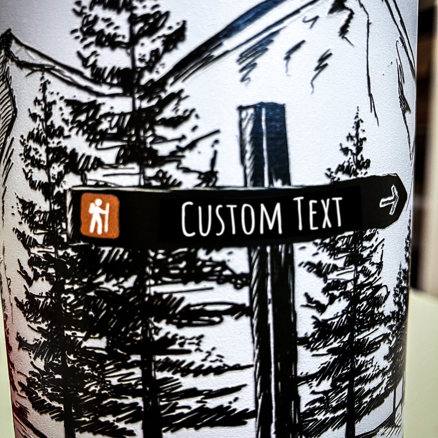 Close up of artwork printed on water bottle showing the line work and art details of the custom signpost. 
