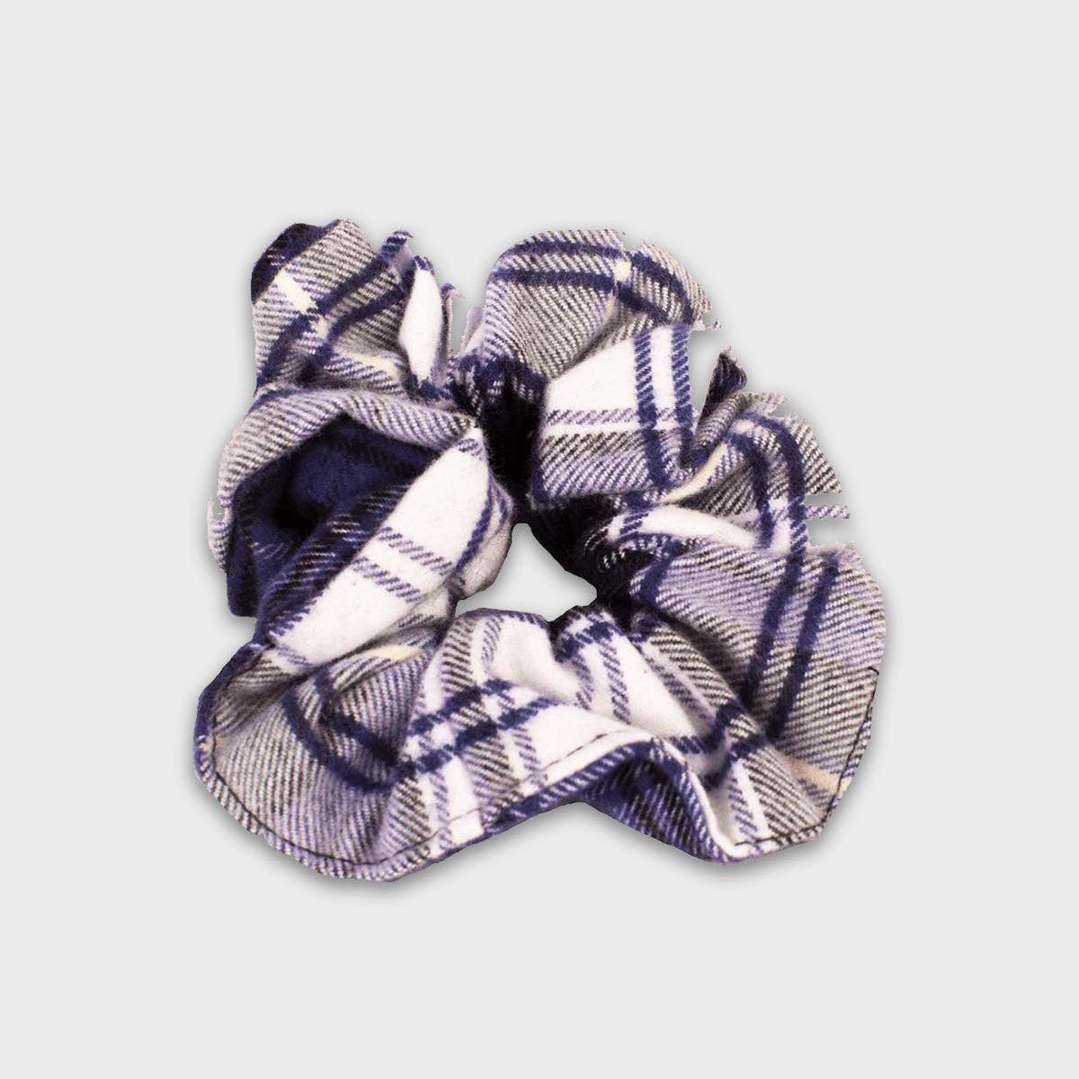 Plaid patterned scrunchie on a light gray background