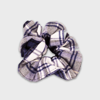 Plaid patterned scrunchie on a light gray background