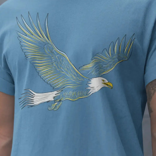 Model wearing Bald Eagle T-Shirt in blue, featuring a bold illustrated eagle design, perfect for patriots and wildlife enthusiasts.