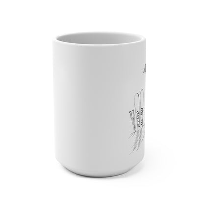 Front view on a desk of this 15oz ceramic mug is perfect for anyone who loves the thrill of the slopes and cozy mornings. Featuring a minimalist pen-and-ink illustration of skis and a snowboard stuck in snow, accompanied by the hand-written phrase Find Us on the Mountain Slopes, this mug captures the essence of winter adventures. 