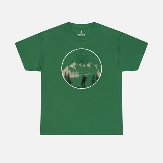 A green Unisex Cotton Tee on white background, featuring a captivating hand-drawn illustration that encapsulates the spirit of hiking. Featuring majestic mountains and a compass rising in the sky that beckons the call of adventure. 