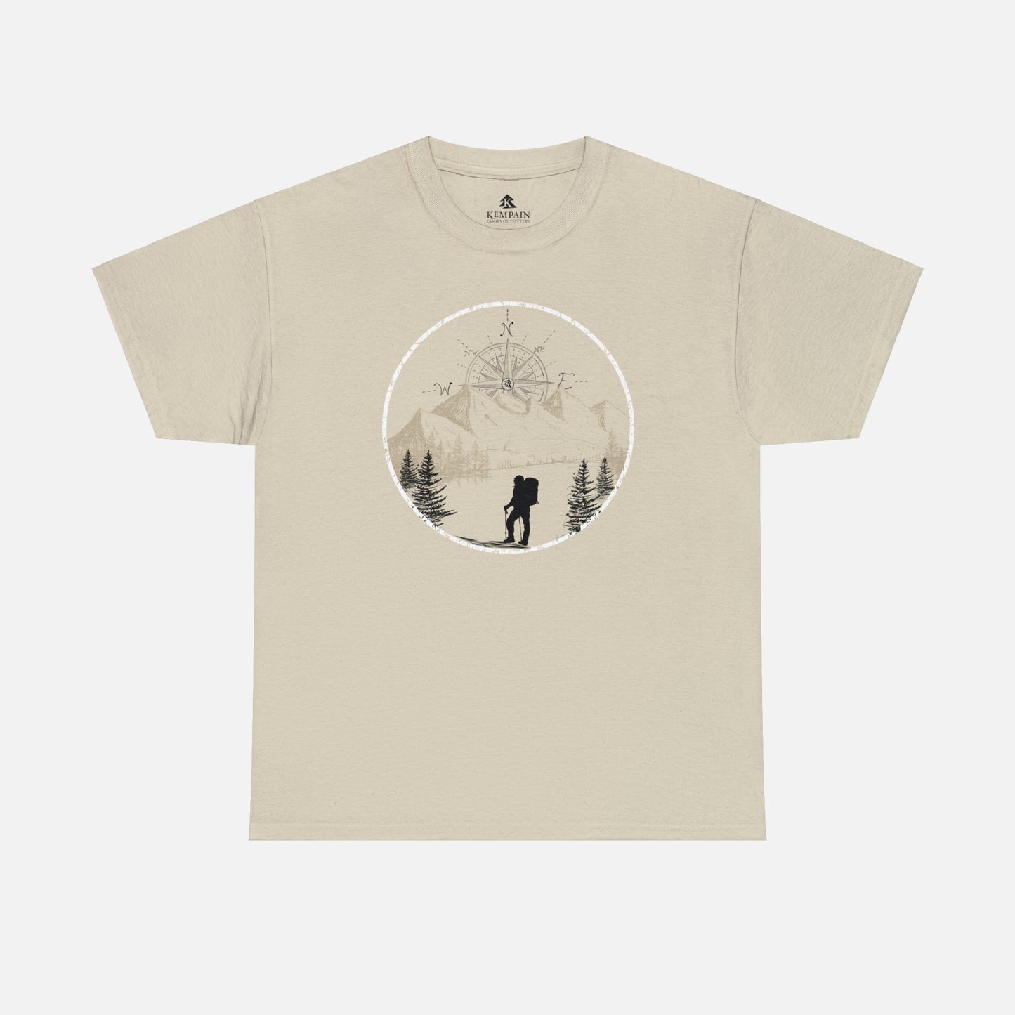 A sand color Unisex Cotton Tee on white background, featuring a captivating hand-drawn illustration that encapsulates the spirit of hiking. Featuring majestic mountains and a compass rising in the sky that beckons the call of adventure. 