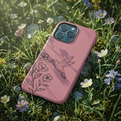 Pink phone case with a hummingbird design on grass and flowers