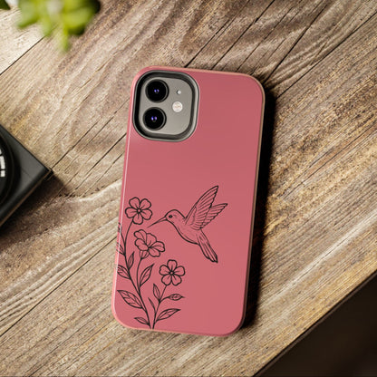 Hummingbird & Flowers Phone Case styled on wooden table with flowers, showcasing artistic and nature-inspired design.