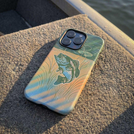 Phone case with largemouth bass design on a bass boat deck floor.