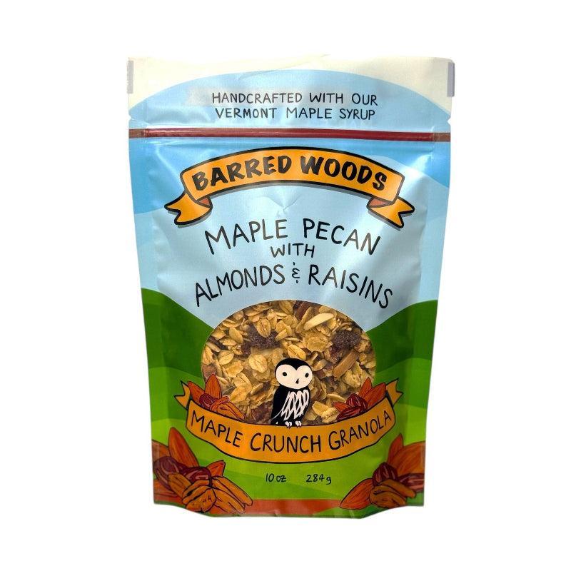 Bag of Barred Woods Maple Crunch Granola with pecans, almonds, and raisins on a white background