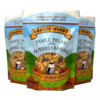 Three packages of Barred Woods Maple Crunch Granola with almonds and raisins on a white background.
