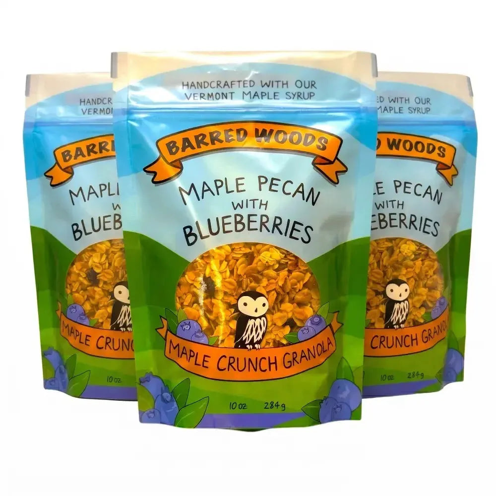 Three packages of Barred Woods Maple Crunch Granola with Blueberries on a white background