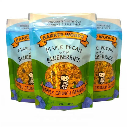 Three packages of Barred Woods Maple Crunch Granola with Blueberries on a white background