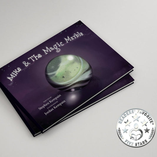 Book titled 'Mike & The Magic Marble' with a green marble on a purple cover, on a white background.