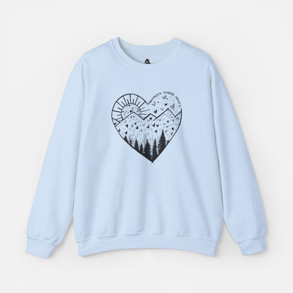 A light blue crewneck sweatshirt featuring a heart-shaped mountain design with the text and Mountains Inspire Hearts, perfect for anyone that loves hiking, mountain views, or the outdoors.