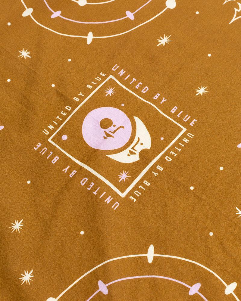 Smoky Ochre Organic Cotton Bandana from United By Blue displayed on a white background.