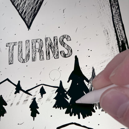 A process image showing a hand drawing the graphic used on the mug featuring a cool Ski Graphic Sign design with the message Earn Your Turns and a Black Diamond Mountain illustration.