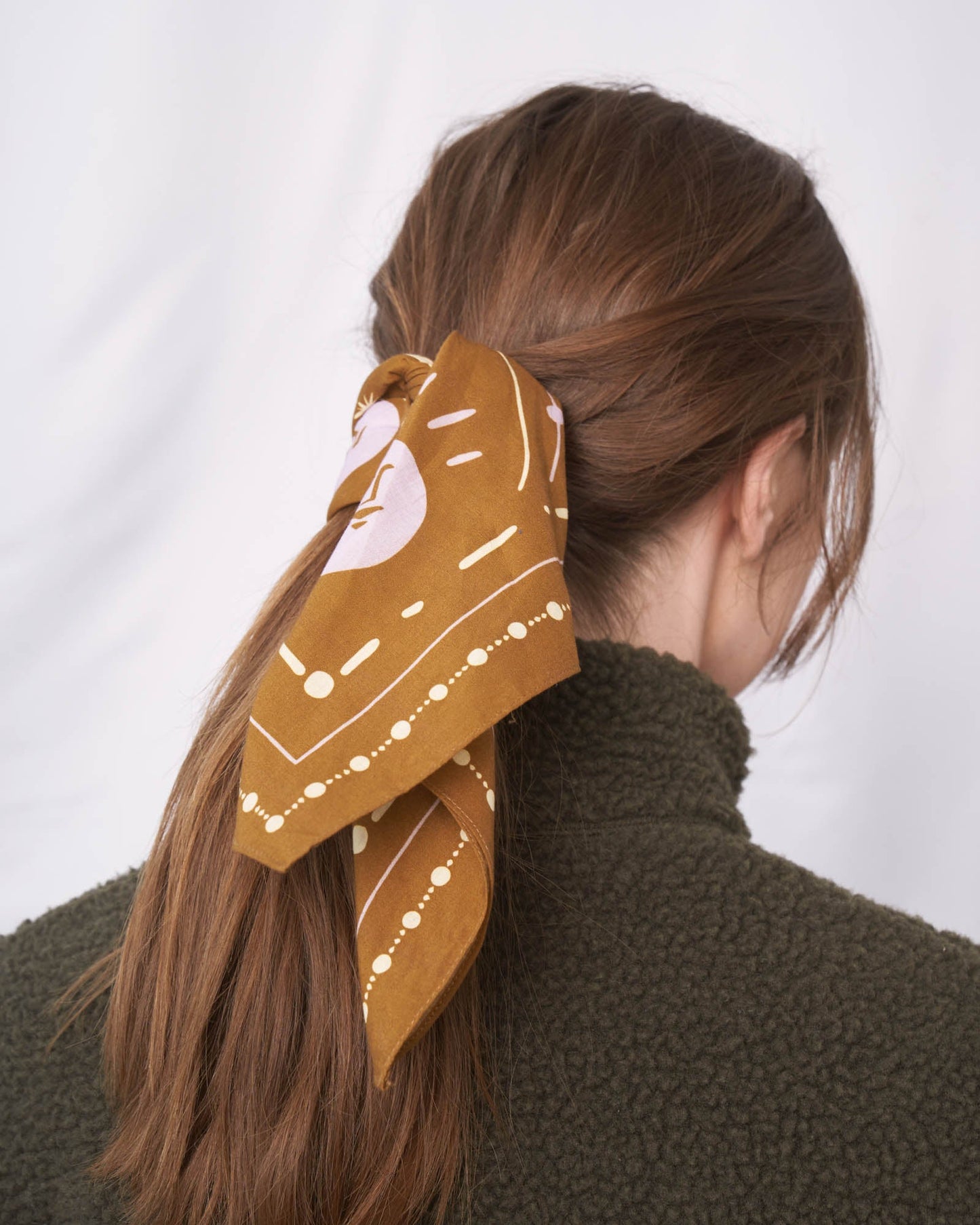 Smoky Ochre Organic Cotton Bandana from United By Blue displayed on female model.