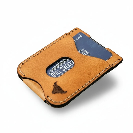 Brown leather wallet with blue card on a wooden surface
