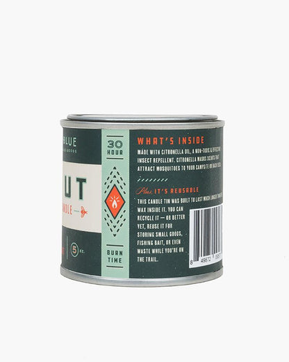 100% GMO-free soy wax for a soot-free, non-toxic burn the 5oz Scout Citronella Candle from United By Blue is displayed on a white background showing label details.