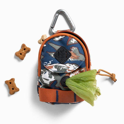 Crafted from 100% (R)evolution™ recycled polyester made from post-consumer plastic bottles The Dog Waste Bag Dispenser in from United By Blue is displayed on a white background with dog bones.