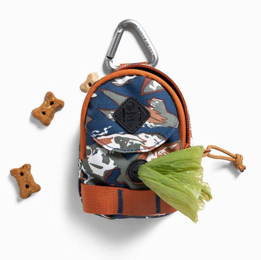 Crafted from 100% (R)evolution™ recycled polyester made from post-consumer plastic bottles The Dog Waste Bag Dispenser in from United By Blue is displayed on a white background with dog bones.