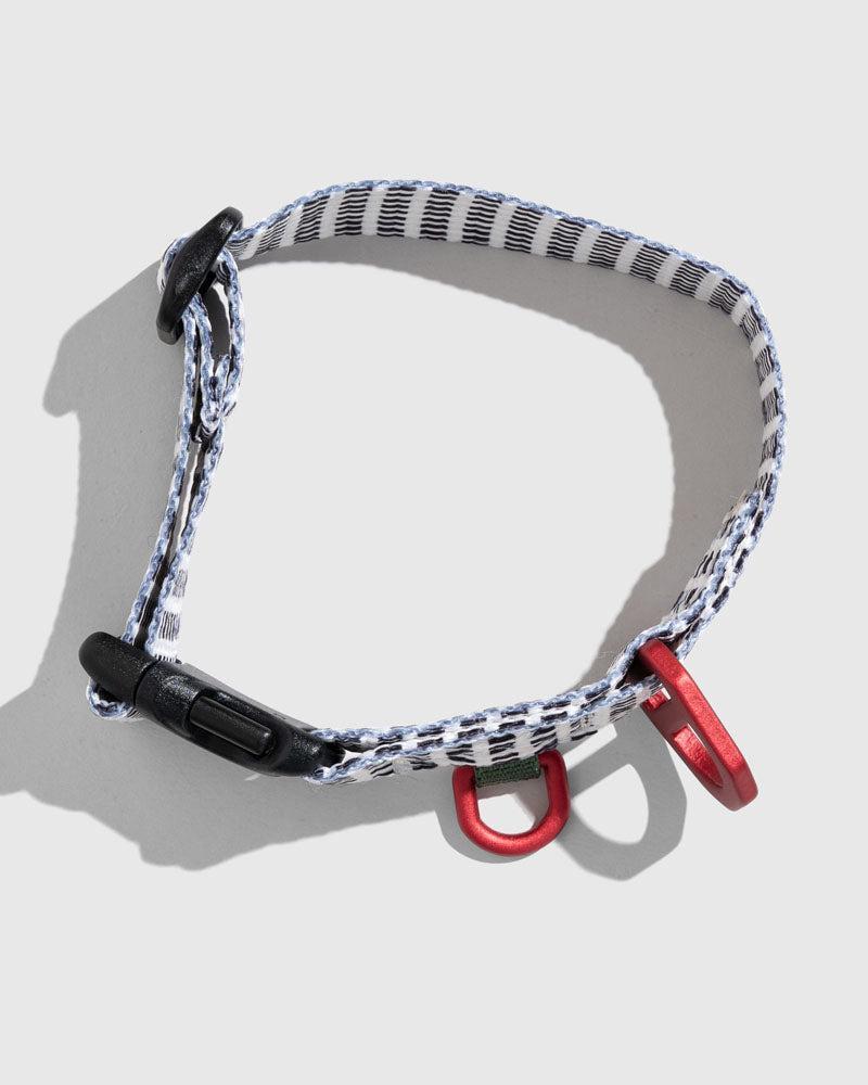 Crafted from 100% (R)evolution™ recycled polyester made from post-consumer plastic bottles the Recycled Woven Dog Collar in Shortbread from United By Blue is displayed on a white background.
