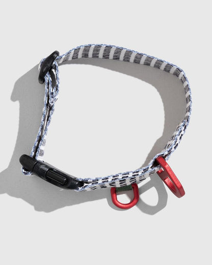 Crafted from 100% (R)evolution™ recycled polyester made from post-consumer plastic bottles the Recycled Woven Dog Collar in Shortbread from United By Blue is displayed on a white background.