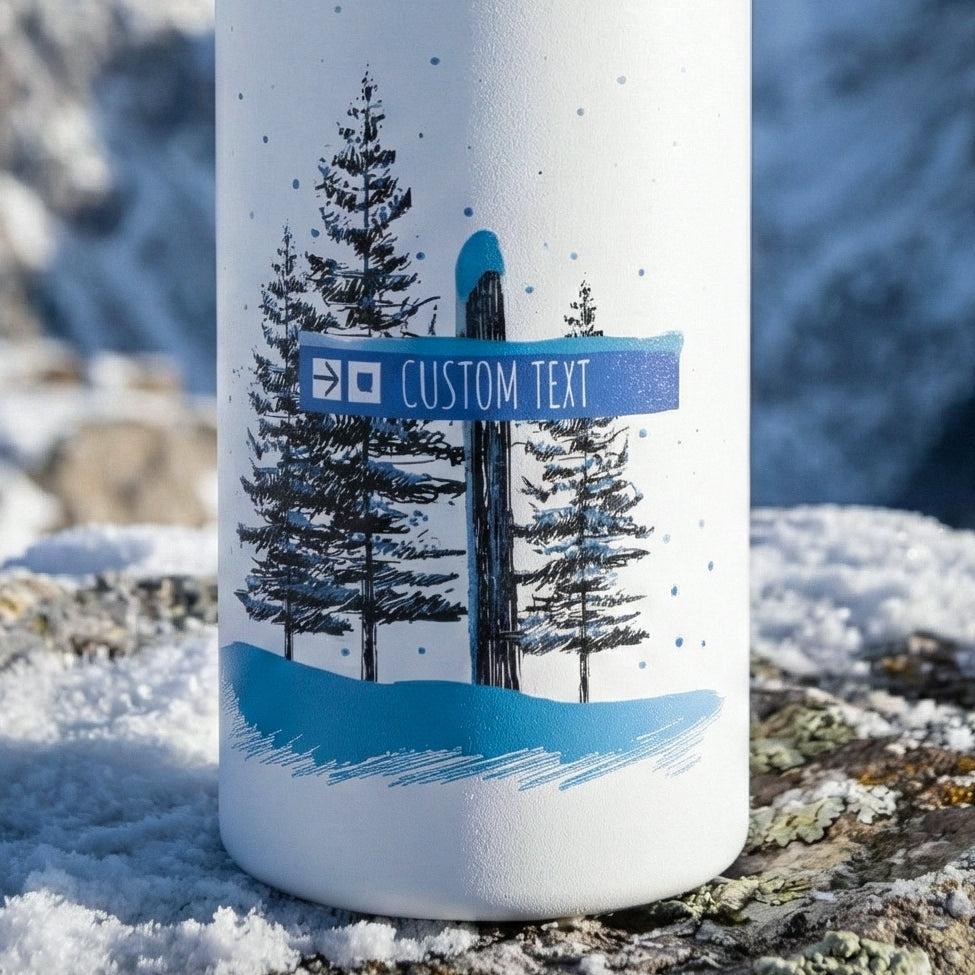 Custom Blue Trail Ski Trail Signpost Commissioned Water Bottle for Skiers and Snowboarders, Original Artwork by Jordan Kempain photographed in winter mountain scene.