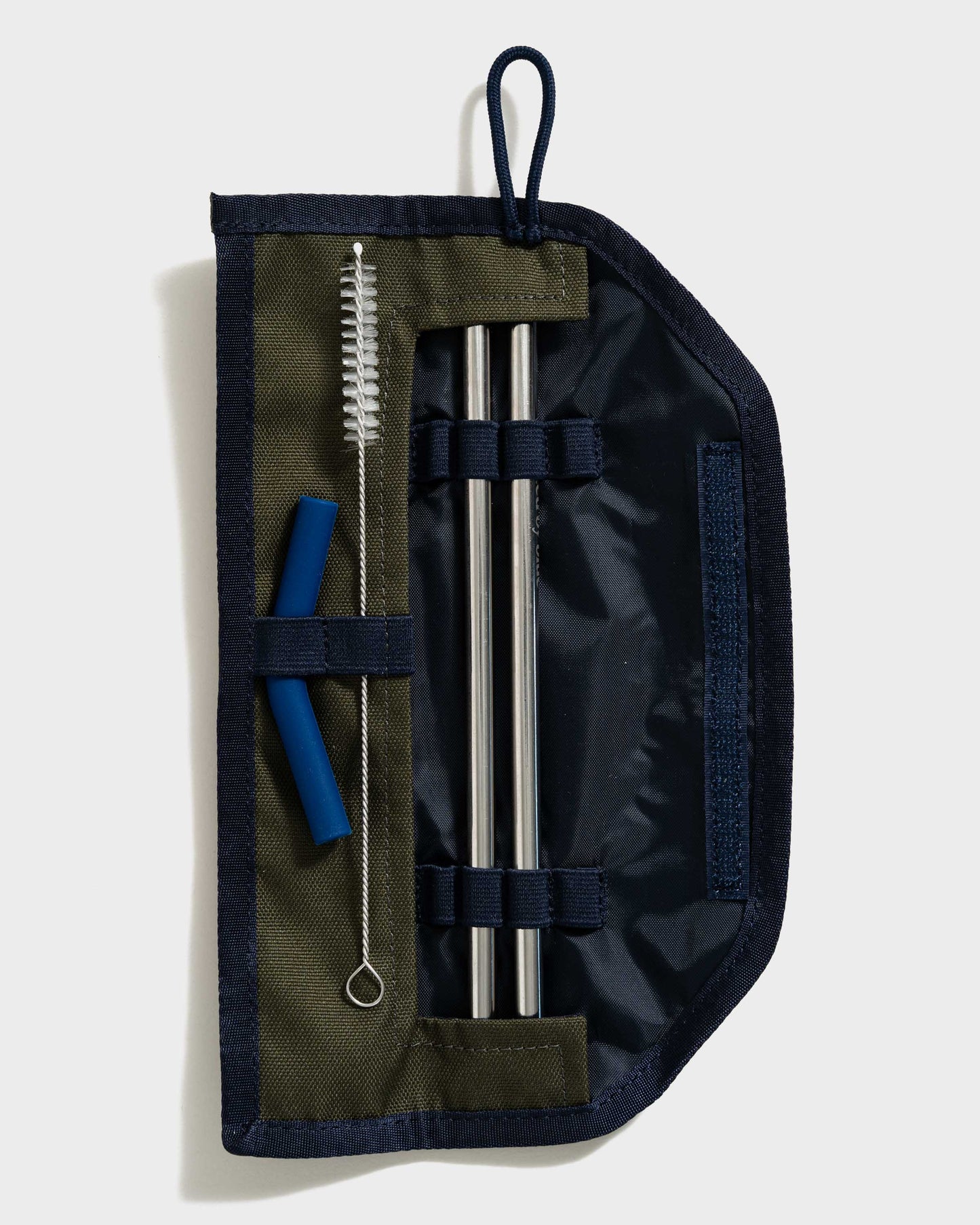 The Straw Kit in Olive from United By Blue Olive displayed open on a white background.