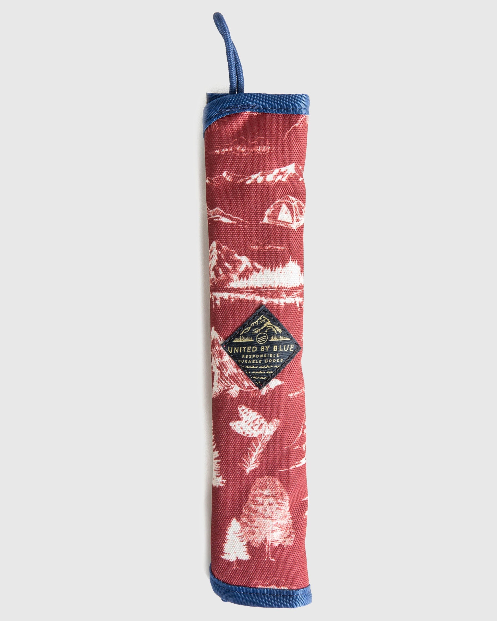 The Straw Kit in Pink from United By Blue displayed on a white background rolled up.