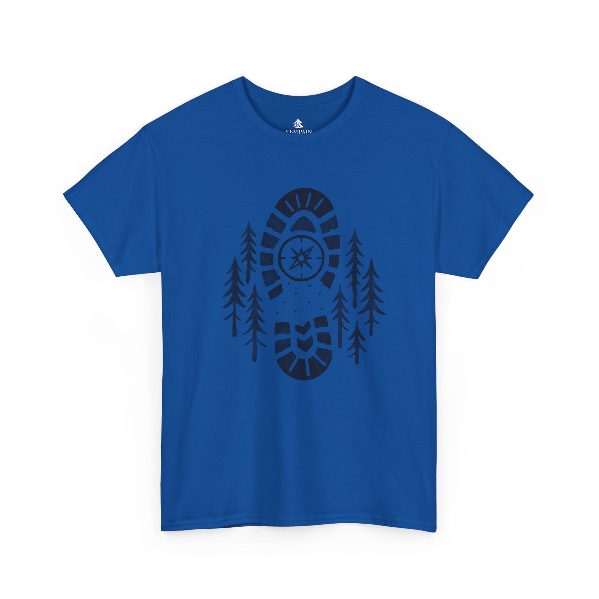 Royal Blue Boot Print Compass Forest T-Shirt worn by model in a pine forest setting, showcasing rugged hiking design for nature lovers.